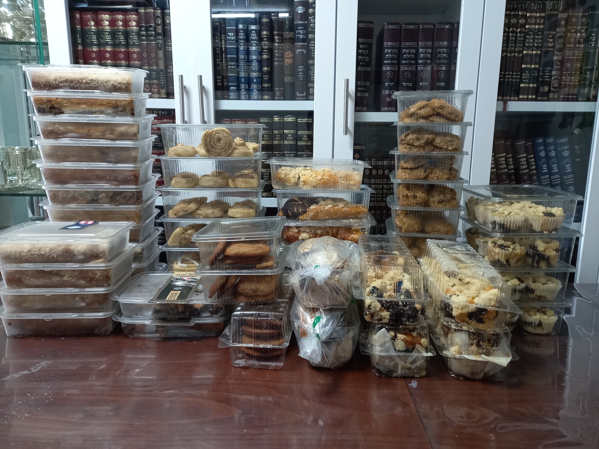 Stacks of packaged cakes and cookies prepared for soldiers